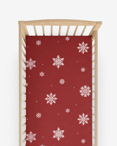 Weihnachtliches Spannbetttuch aus Baumwolle für Babybetten - Schneeflocken auf Rot