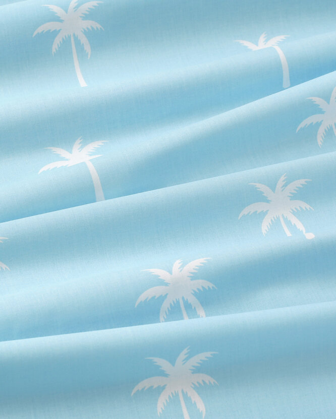 Baumwollstoff - Palmen auf Pastellblau