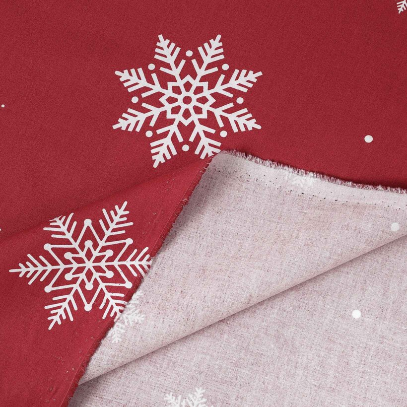 Weihnachtlicher Baumwollstoff - Schneeflocken auf Rot