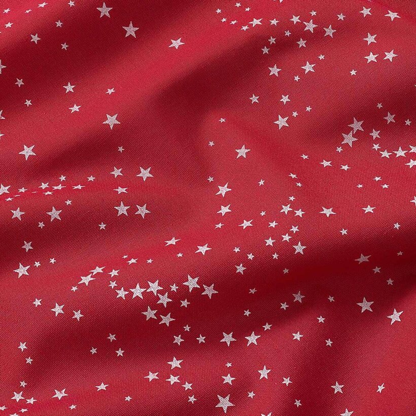 Ovale Weihnachts-Tischdecke Valencia – Sterne auf rotem Hintergrund
