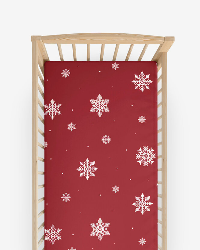 Weihnachtliches Spannbetttuch aus Baumwolle für Babybetten - Schneeflocken auf Rot