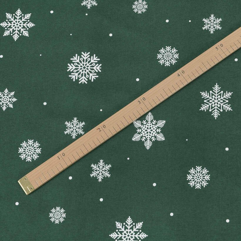 Weihnachtlicher Flanellstoff - Schneeflocken auf Grün