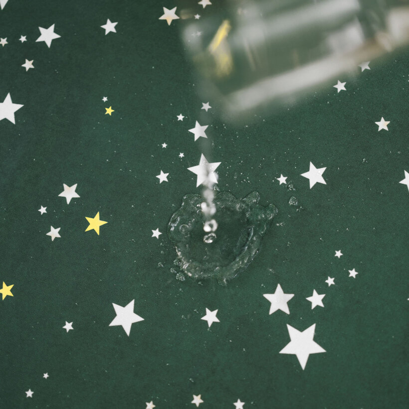 Eckige weihnachtliche Teflon-Tischdecke - Sterne auf Grün