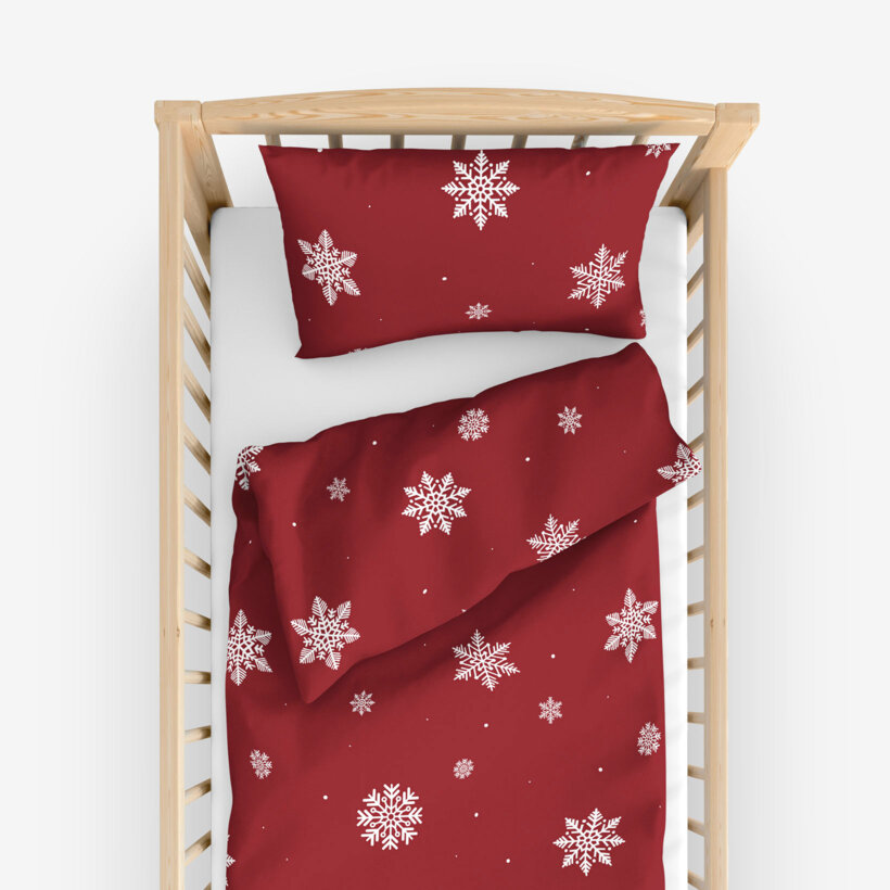 Weihnachtliche Bettwäsche für Babybetten aus Baumwolle - Schneeflocken auf Rot