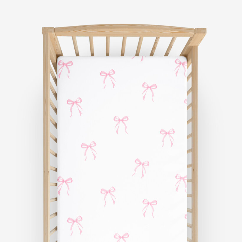 Spannbetttuch aus Baumwolle für Babybetten - rosa Schleifen