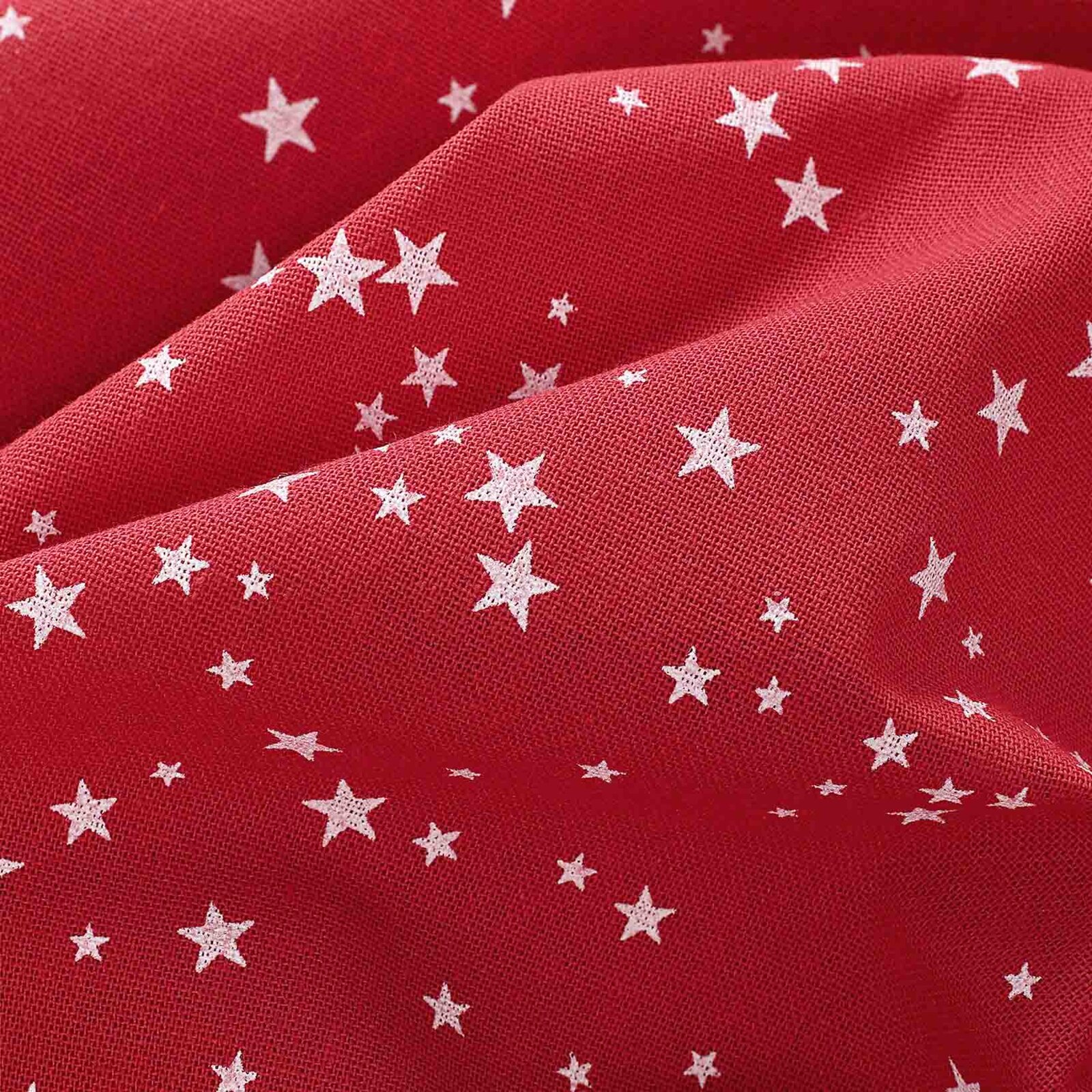 Ovale Weihnachts-Tischdecke Valencia – Sterne auf rotem Hintergrund