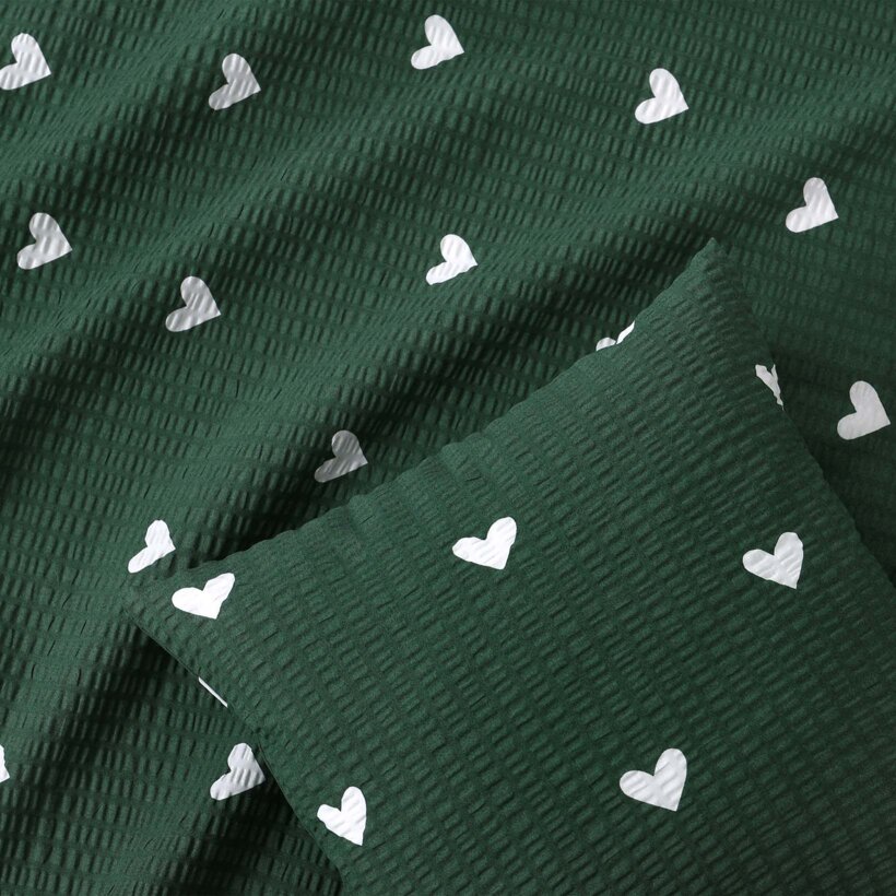Weihnachtlicher Seersucker-Kissenbezug - Herzchen auf dunkelgrün