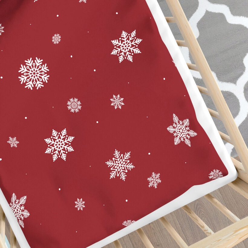 Weihnachtliche Bettwäsche für Babybetten aus Baumwolle - Schneeflocken auf Rot