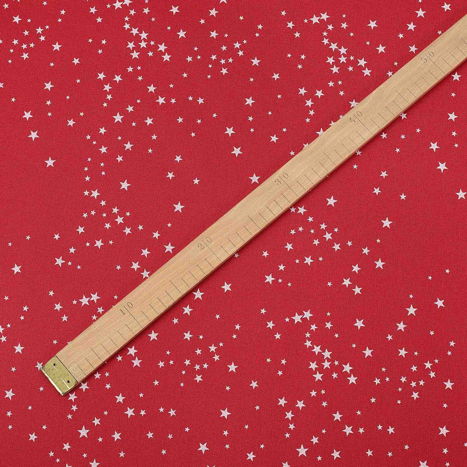 Weihnachtsstoff Valencia - Sterne auf rotem Hintergrund